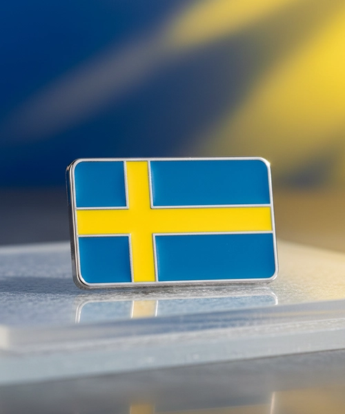 En pin med Sverigemotiv.